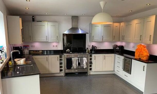 Kitchen after being fully resprayed in grey